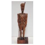 Carved wood soldier sculpture