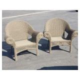Pair of wicker style patio chairs with metal