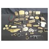 Group of vintage military badges, buckles, etc.