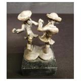 Sterling silver figural sculpture on a marble base