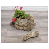 Live plant in pebble covered pelican planter