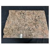Raw edge granite cutting board. 19 1/2 x 14". On