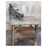 Vintage bench vise mounted on metal table