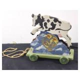 Vintage cow jumps over moon music box pull toy