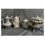 Group of silver plated tea pots with kettle