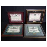 Group of 4 framed stock certificates