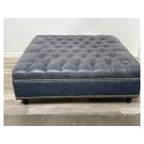 Oversized blue tufted leather storage ottoman