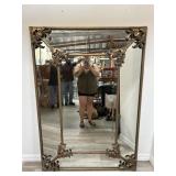 Large ornate gilt beveled wall mirror
