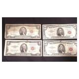 Group of red-seal two dollar bills and five