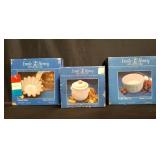 Box of Emile Henry glazed pottery gourmet french