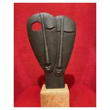 Metal abstract face statue