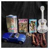 Collectible toy car, figures, and guitar