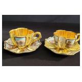 Pair of Coalport demitasse cups and saucers
