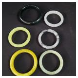 Group of colored glass bangle bracelets