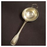 Vintage silver tea strainer marked 800