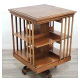Antique revolving bookcase on casters