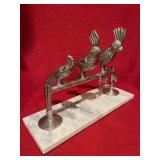 3 metal cockatoos on marble base