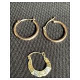 Pair of 14 Kt gold earrings and one 10 Kt earring