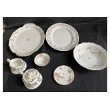 Set of porcelain items such as tea cup, cream