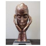 Face in hands compositesculpture mounted on wood