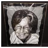 Signed textile portrait in lucite