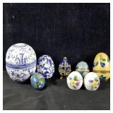 Collection of egg themed items trinket boxes,