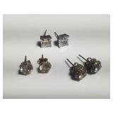 Group of sterling silver earrings with clear