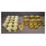 Group of vintage yellow glass tea cups and