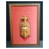 Hand carved Buddha head framed