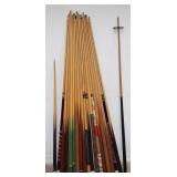 Group of pool sticks, bundled