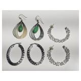 Group of sterling silver earrings with green and