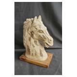 Composite horse bust on a wood base