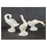 Three lladro duck figurines