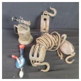 Box of vintage pulleys. Welding torch .