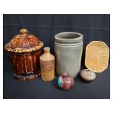 Group of pottery items, jar, bud vase, wall