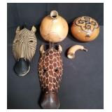 Box of carved wood masks and gourds