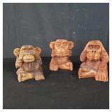 Three carved wood monkeys