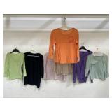 Group of seven womenï¿½s shirts