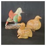 Three carved wood birds