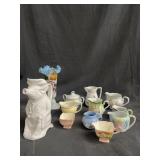 Box of tea cups, a pitcher, and a vase