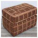 Upholstered ottoman on casters