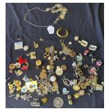 Group of costume jewelry pins & earrings