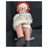 Vintage raggedy Ann with rocking bed