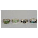 Four sterling silver and turquoise rings