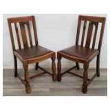 Pair of antique vinyl seat side chairs