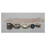 Four sterling silver rings one pewter, one