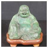 Vintage brass Buddha on a teakwood stand