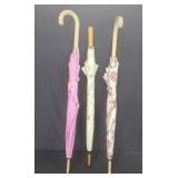 Three vintage umbrellas