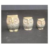 Three brass owl paperweights