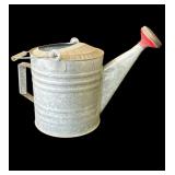 Vintage galvanized metal watering can